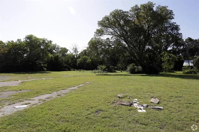 a backyard of a house with lots of green space