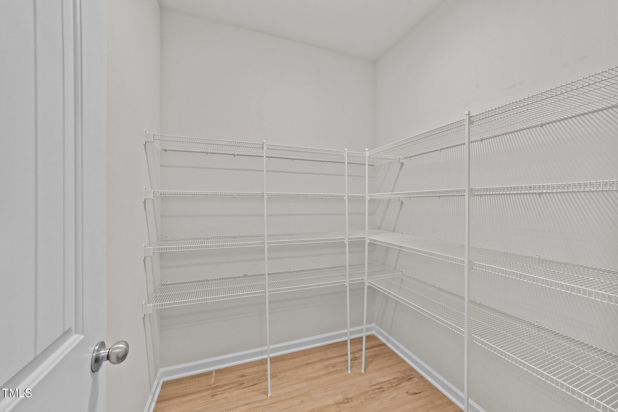 188 Karlov Road Garner, NC 27529 - Photo 16 of 38 a view of a room with empty racks