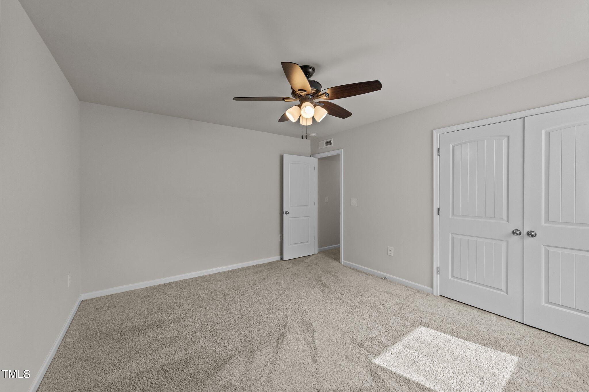 188 Karlov Road Garner, NC 27529 - Photo 26 of 38 a view of a chandelier fan in a room