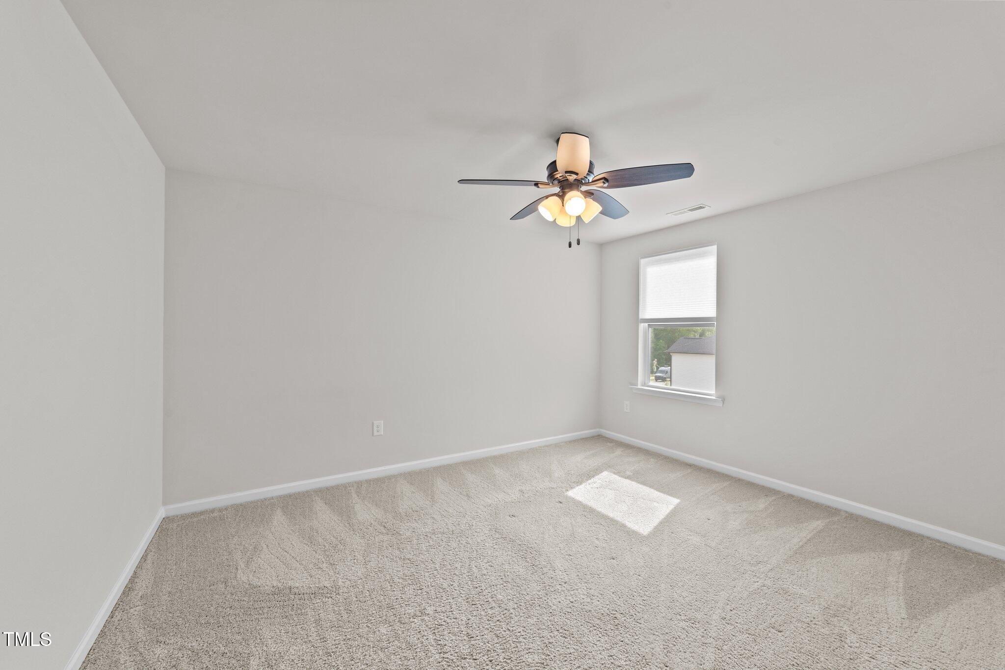 188 Karlov Road Garner, NC 27529 - Photo 27 of 38 an empty room with a window