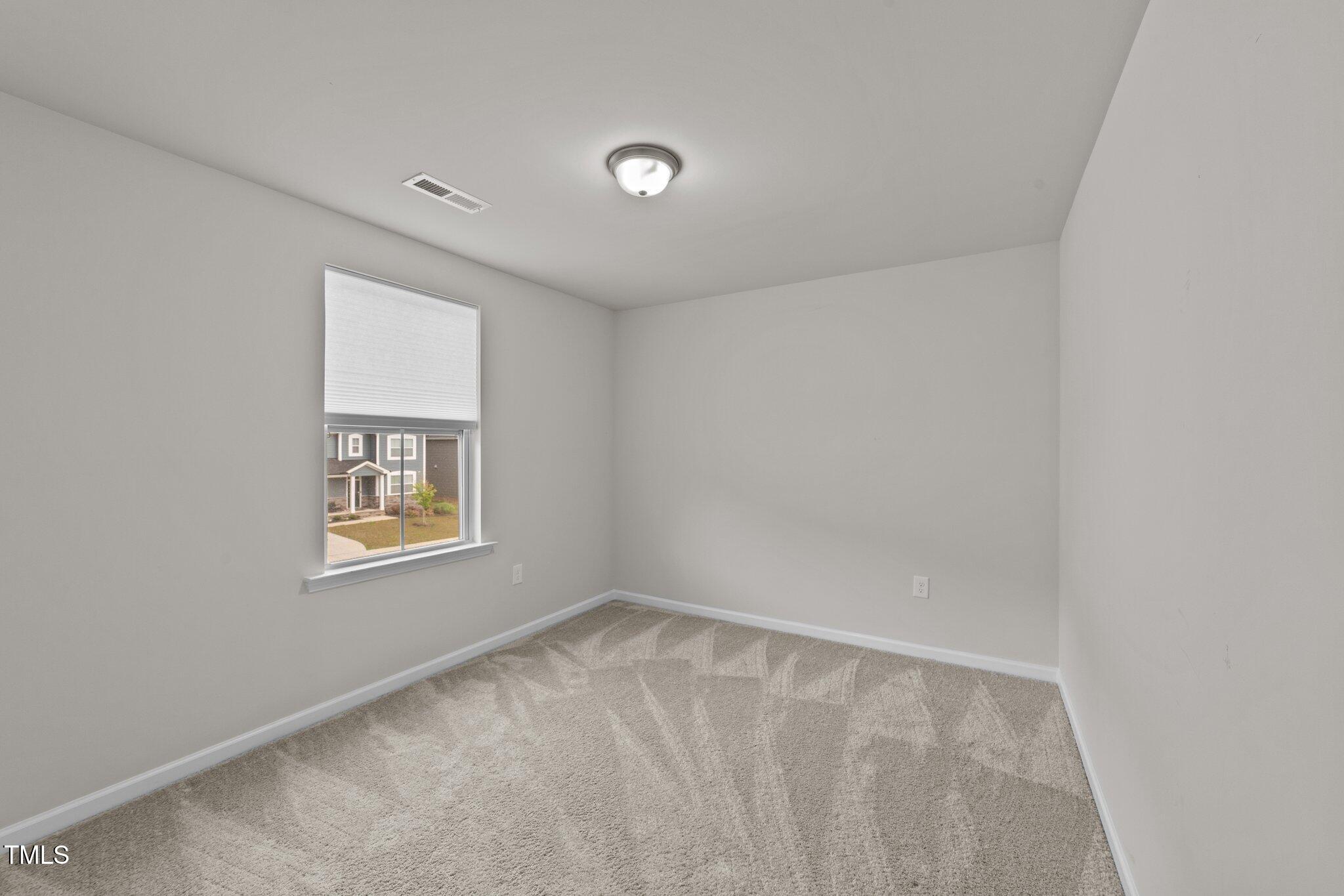 188 Karlov Road Garner, NC 27529 - Photo 30 of 38 a view of an empty room with a window