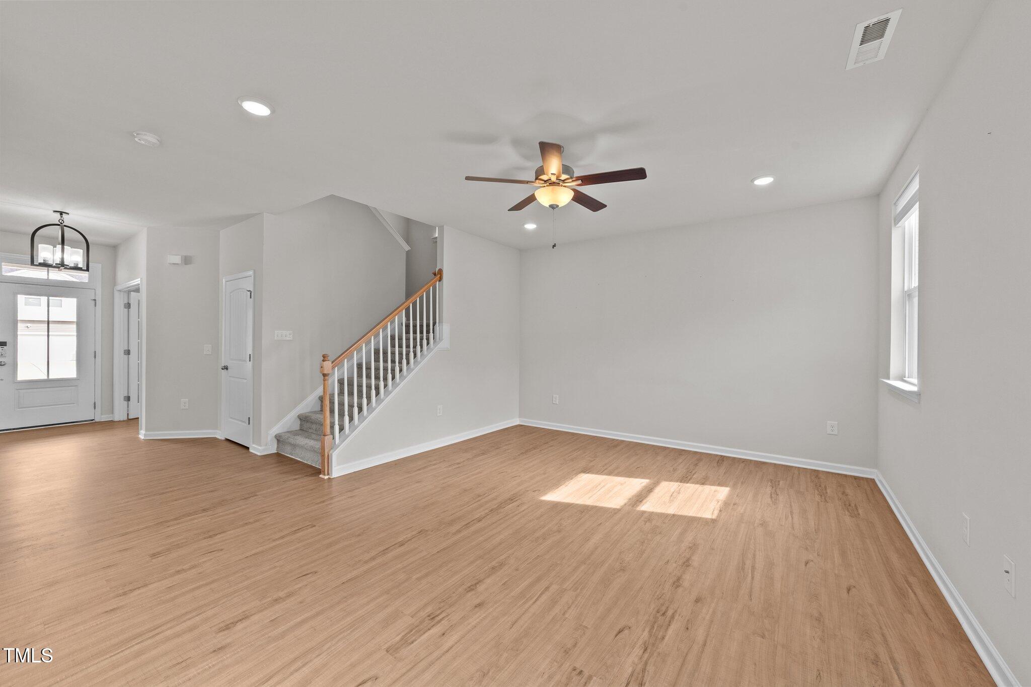 188 Karlov Road Garner, NC 27529 - Photo 9 of 38 a view of empty room with wooden floor and fan