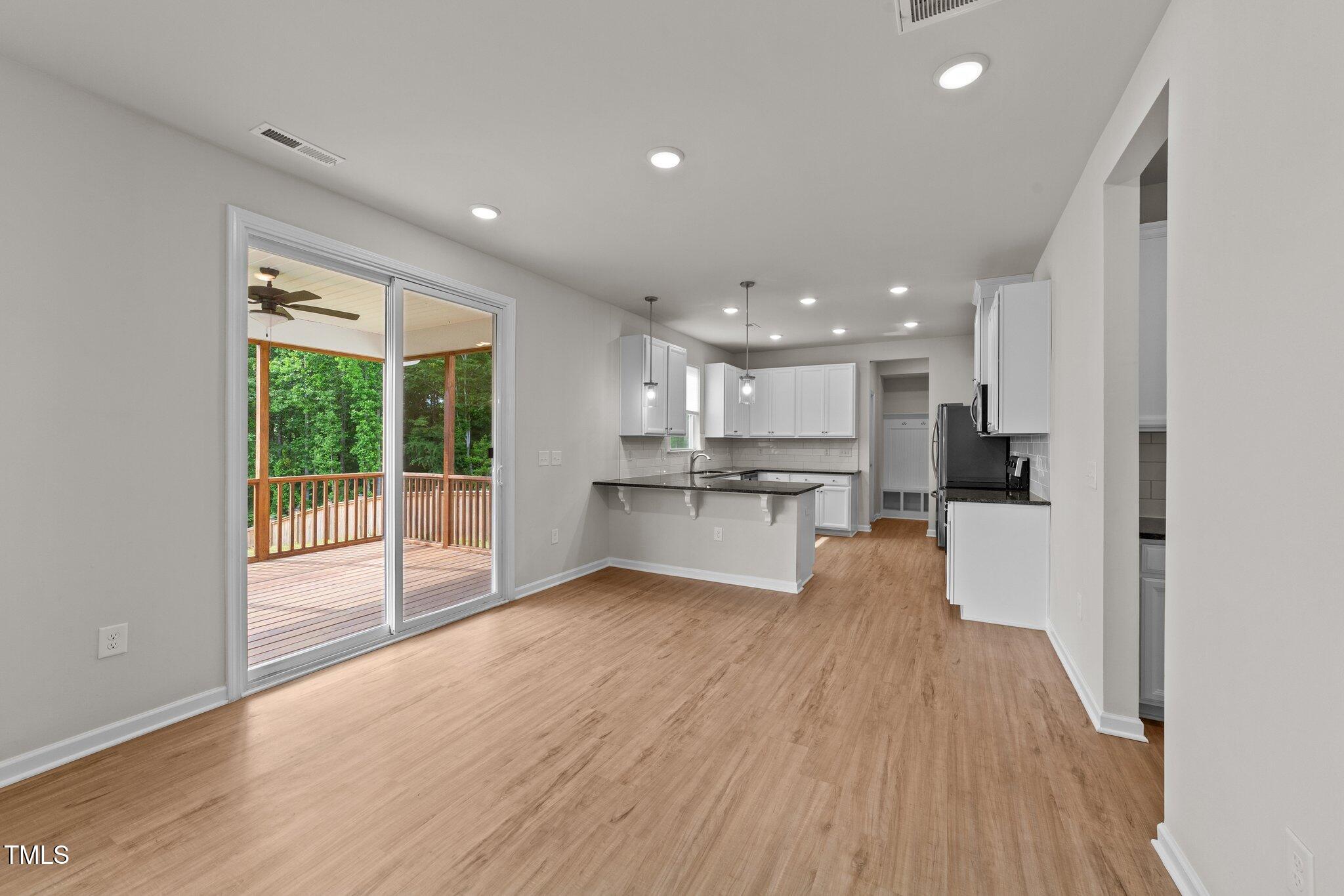 188 Karlov Road Garner, NC 27529 - Photo 10 of 38 a view of kitchen with wooden floor