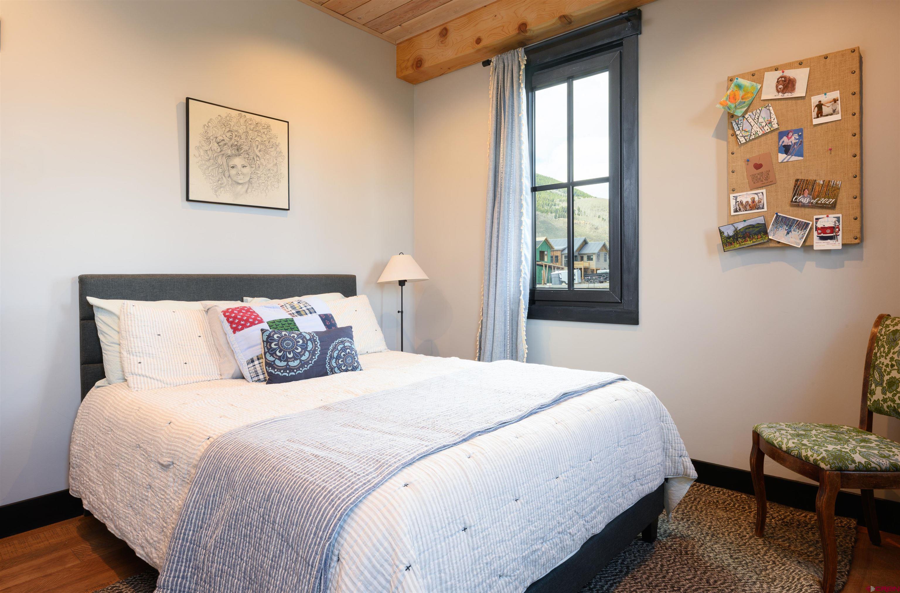 96 Chestnut Lane Crested Butte, CO 81224 - Photo 11 of 37 a bedroom with a bed and a window