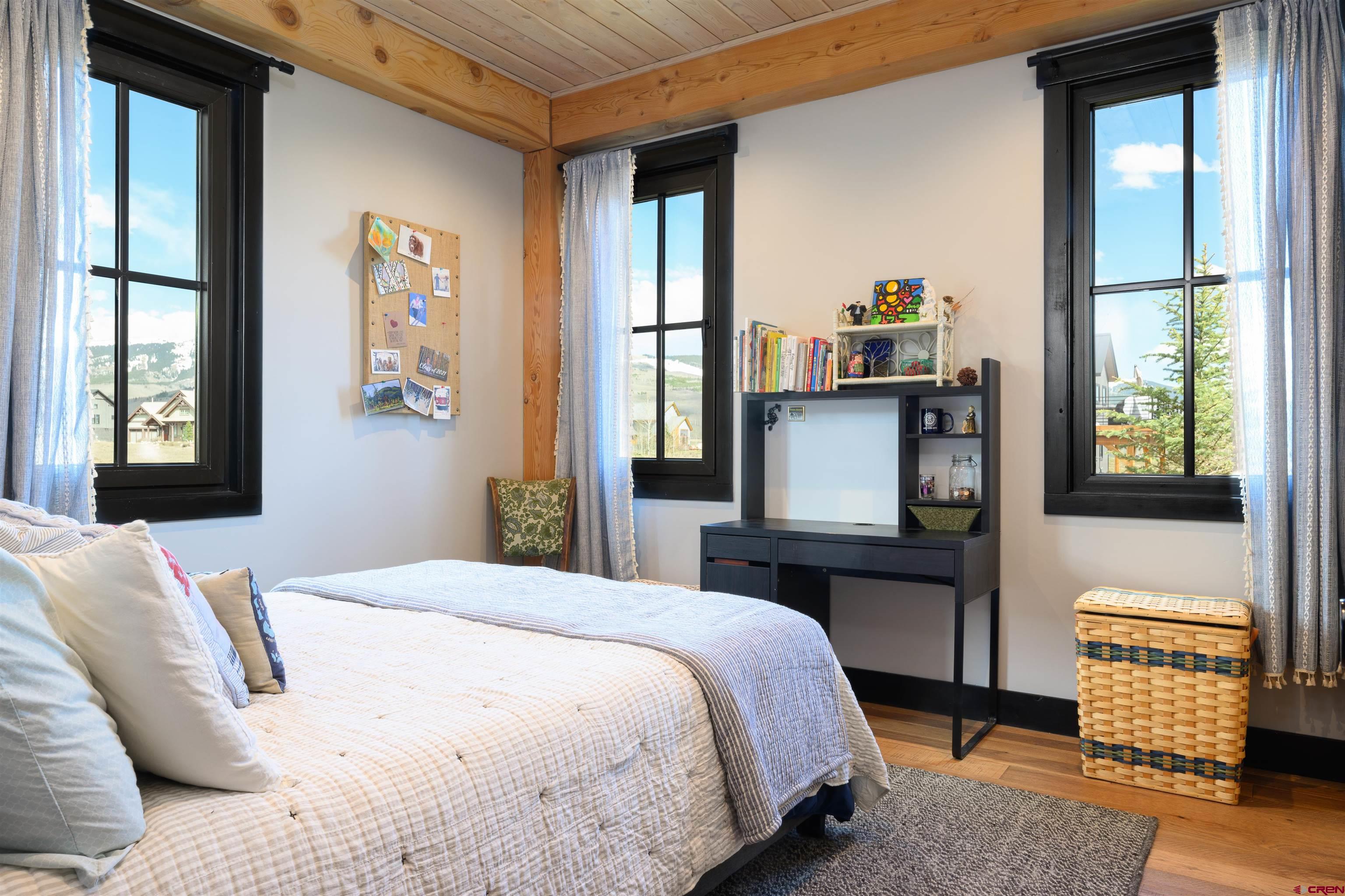 96 Chestnut Lane Crested Butte, CO 81224 - Photo 12 of 37 a bedroom with a bed and window