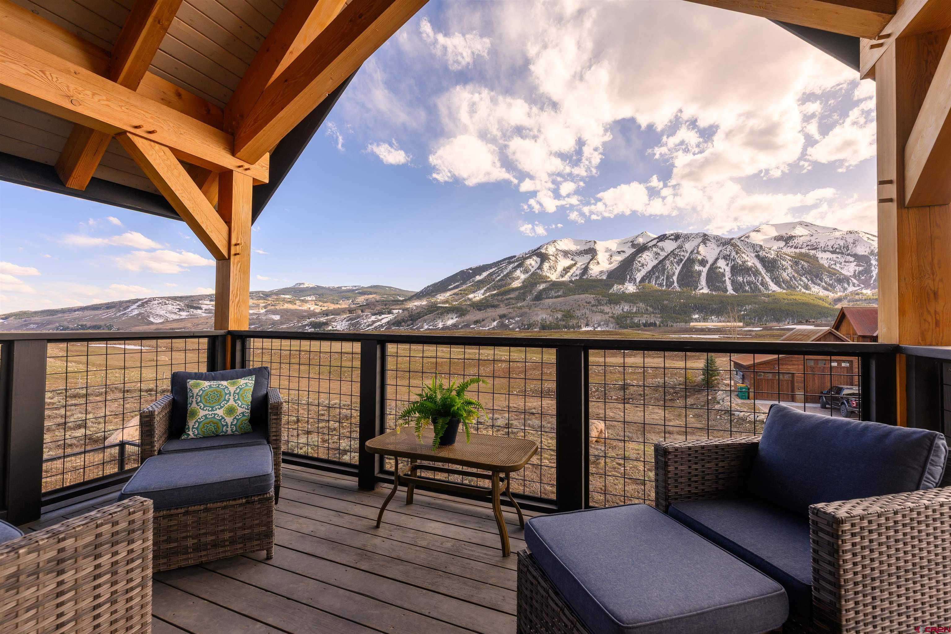 96 Chestnut Lane Crested Butte, CO 81224 - Photo 18 of 37 an outdoor view from a balcony with seating space