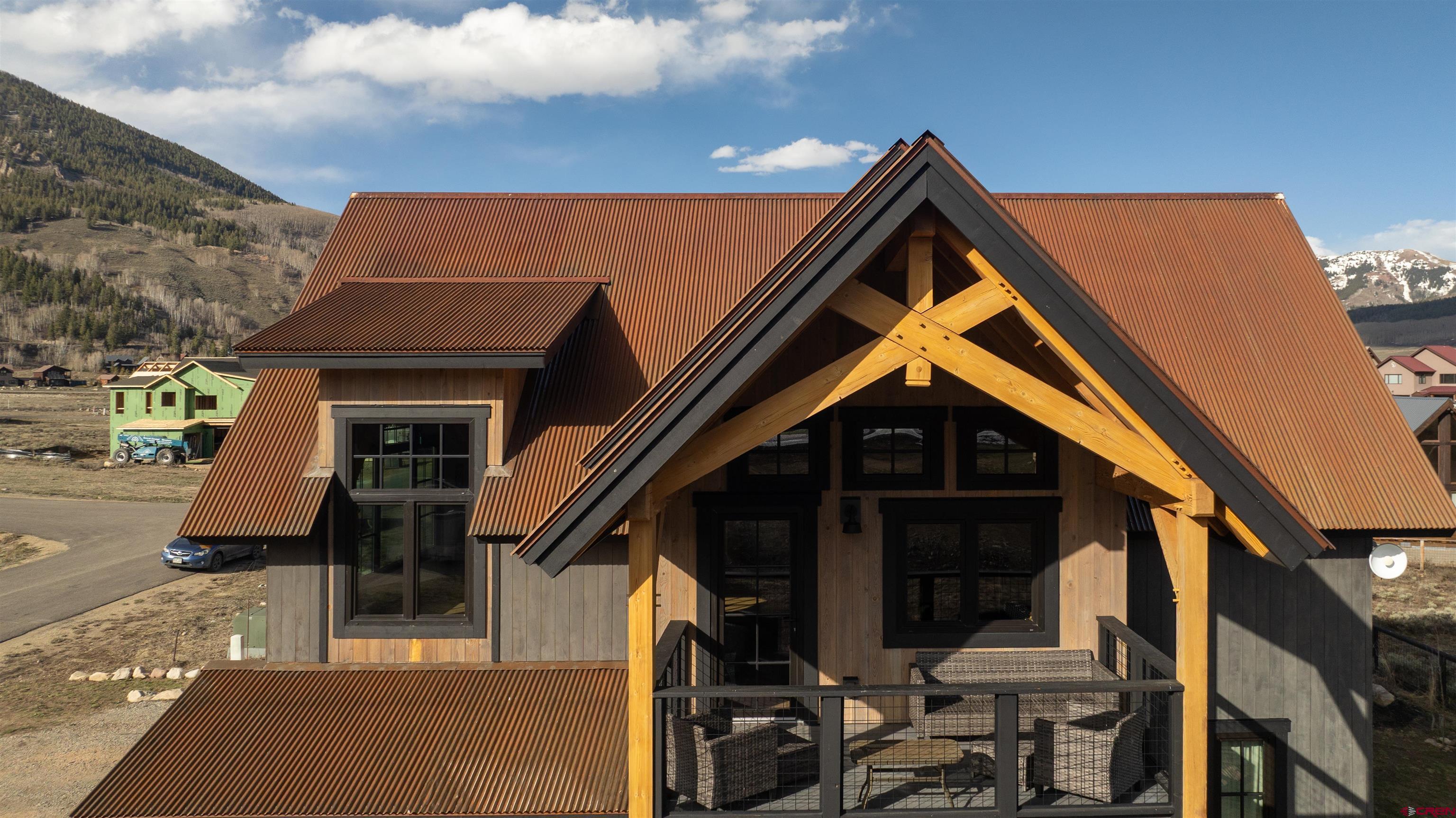 96 Chestnut Lane Crested Butte, CO 81224 - Photo 21 of 37 a front view of a house with parking