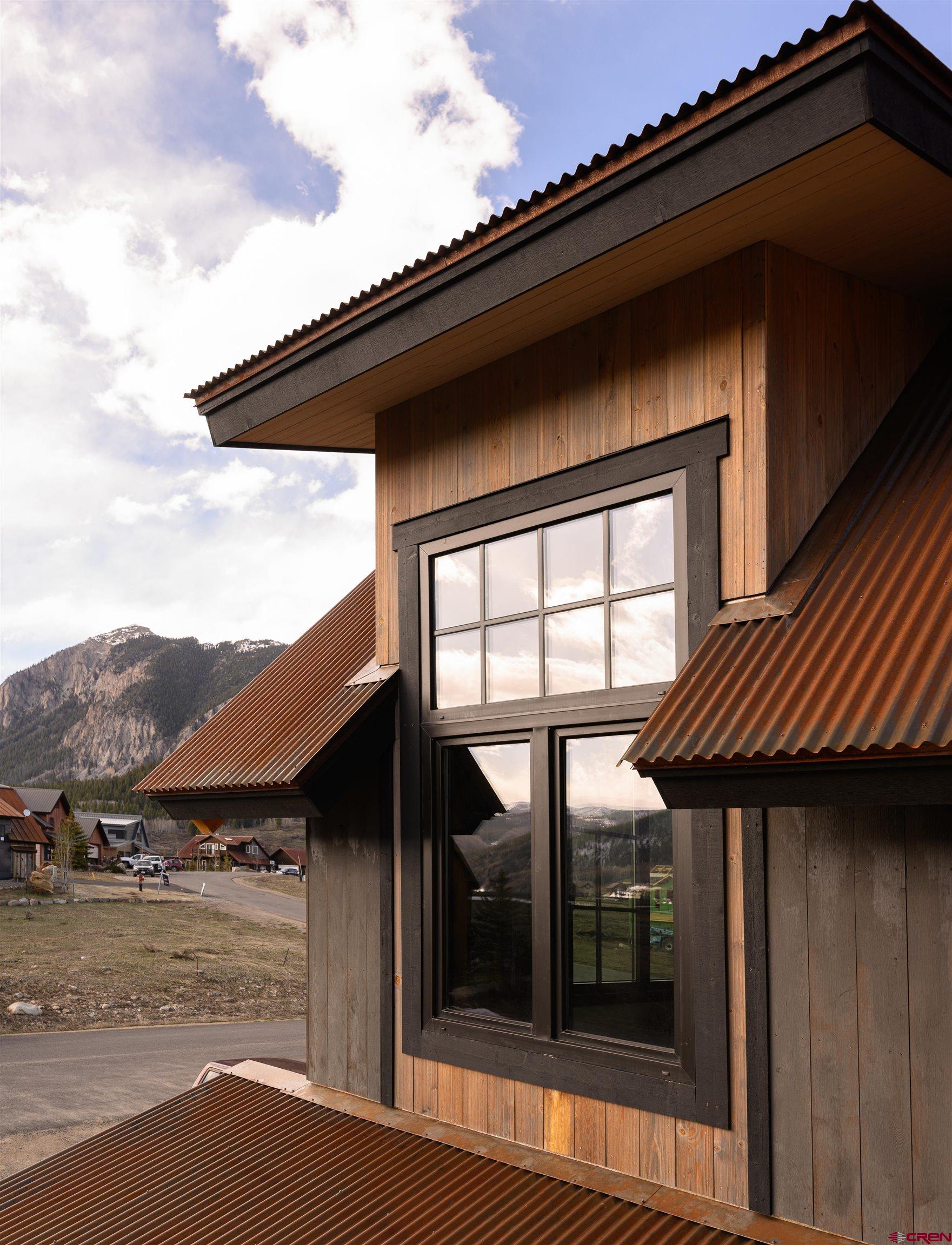 96 Chestnut Lane Crested Butte, CO 81224 - Photo 30 of 37 a view of a house with a door and balcony