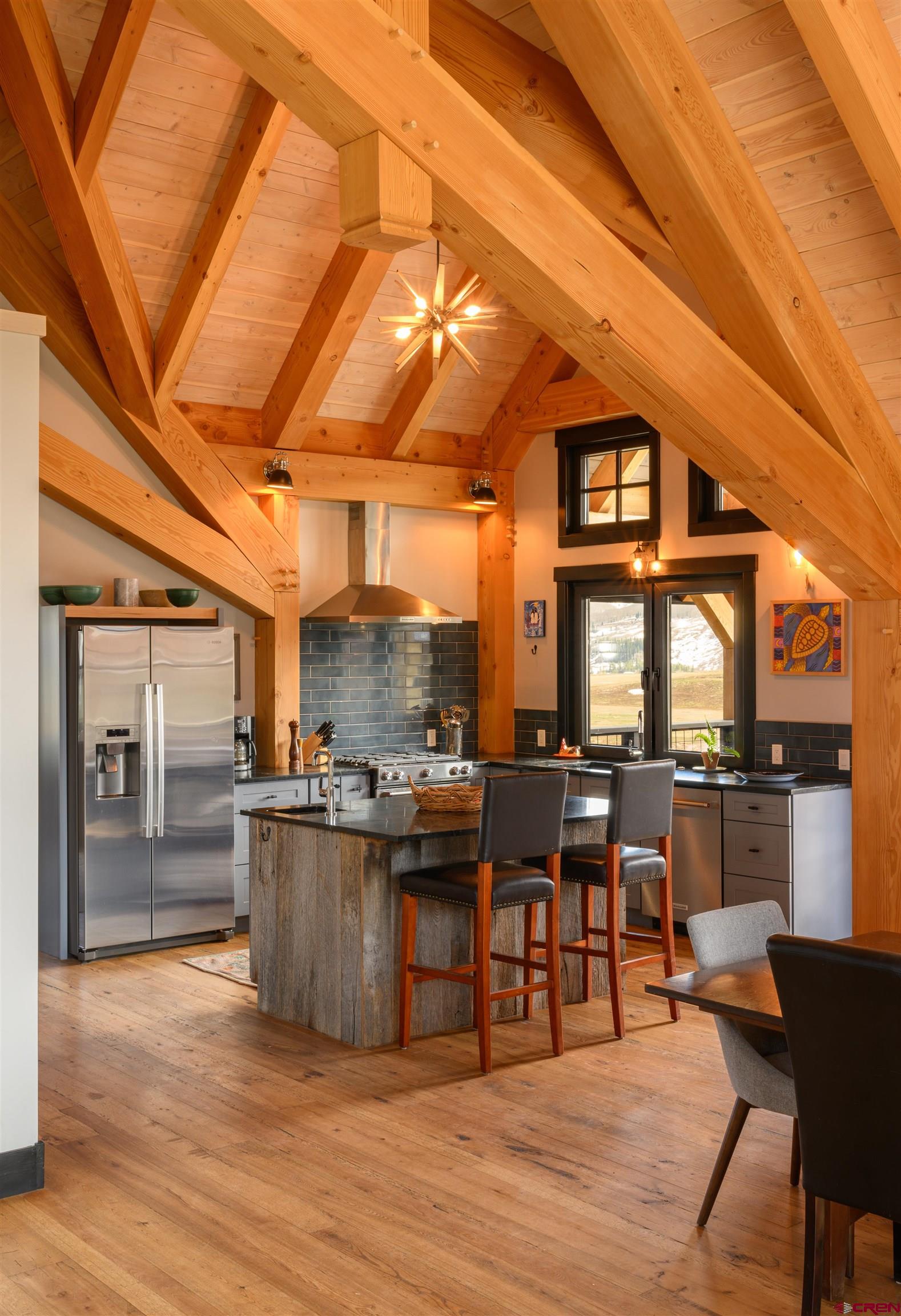 96 Chestnut Lane Crested Butte, CO 81224 - Photo 3 of 37 a view of a dining room with furniture window and wooden floor