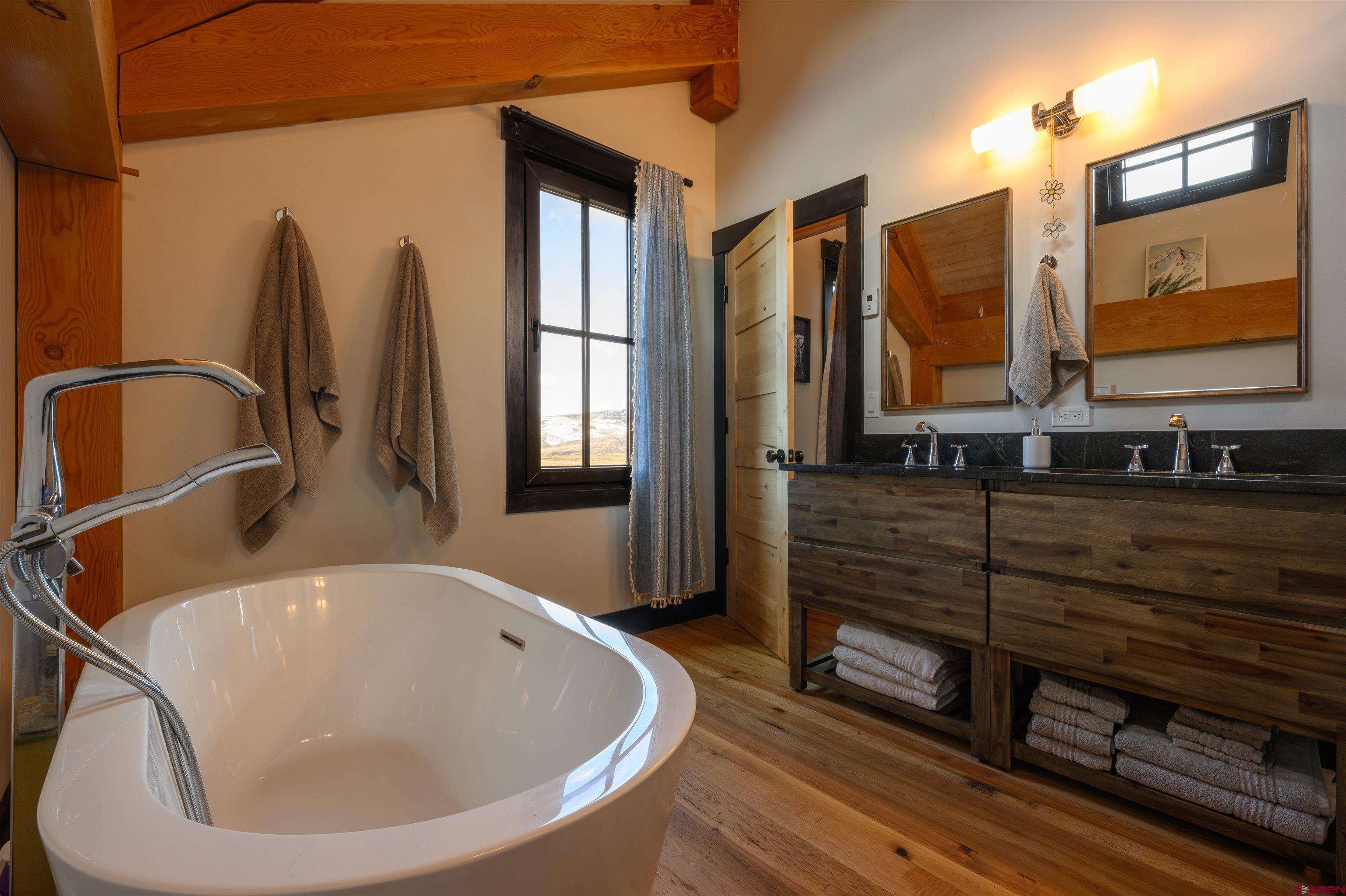 96 Chestnut Lane Crested Butte, CO 81224 - Photo 9 of 37 a bathroom with a sink and a mirror