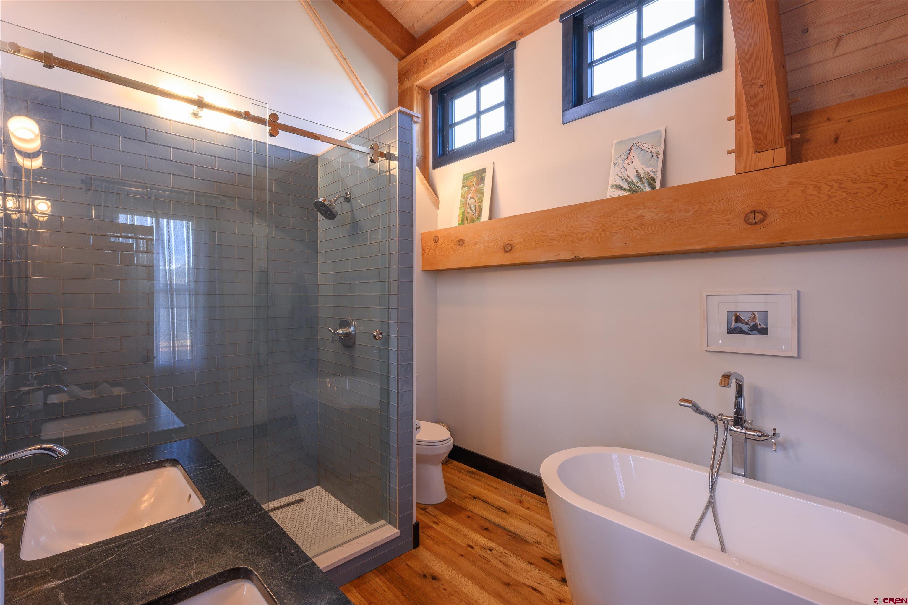 96 Chestnut Lane Crested Butte, CO 81224 - Photo 10 of 37 a bathroom with a bathtub and shower