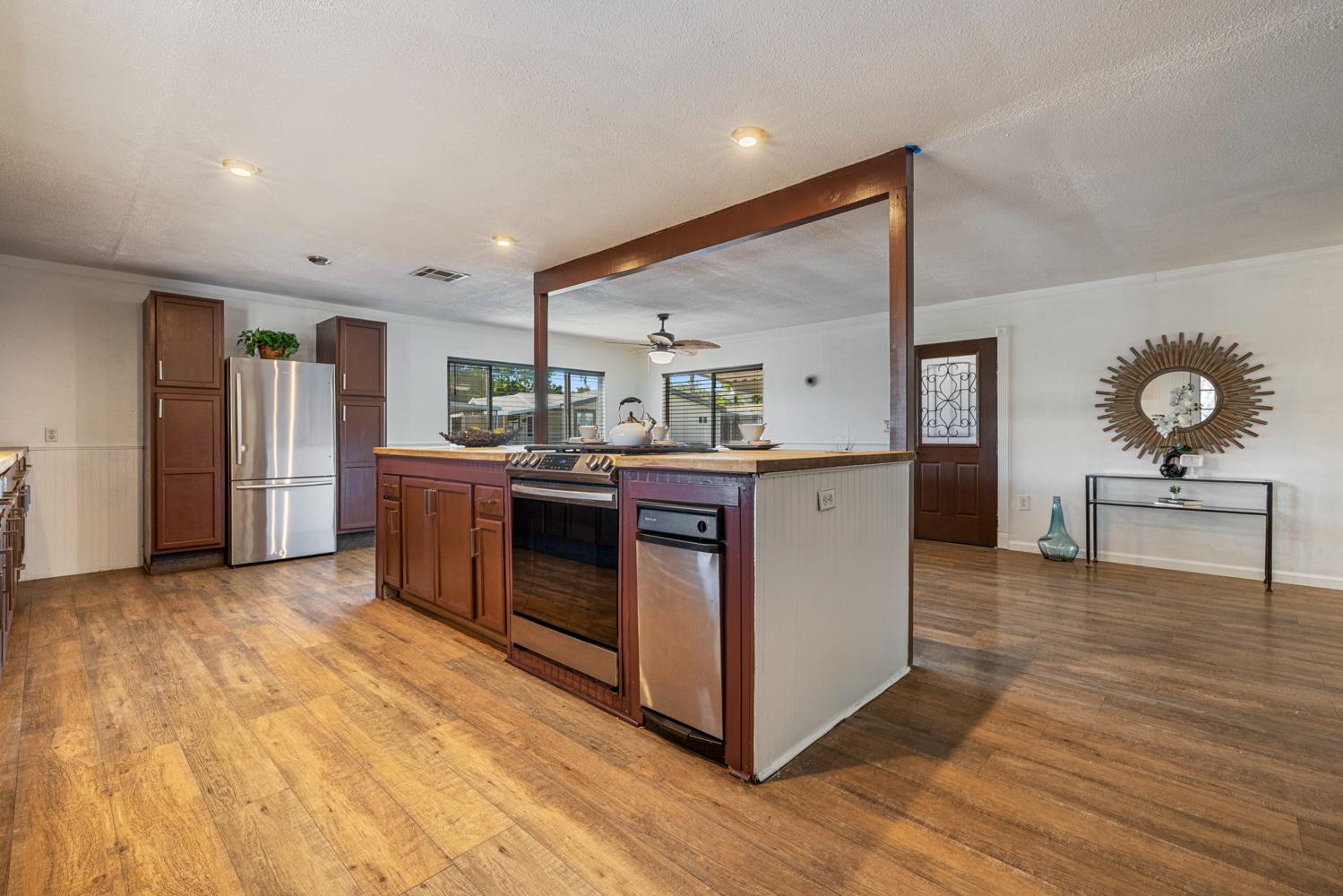 2621 Prescott Road, Unit 79 Modesto, CA 95350 - Photo 23 of 41 a kitchen with stainless steel appliances granite countertop a sink and a refrigerator