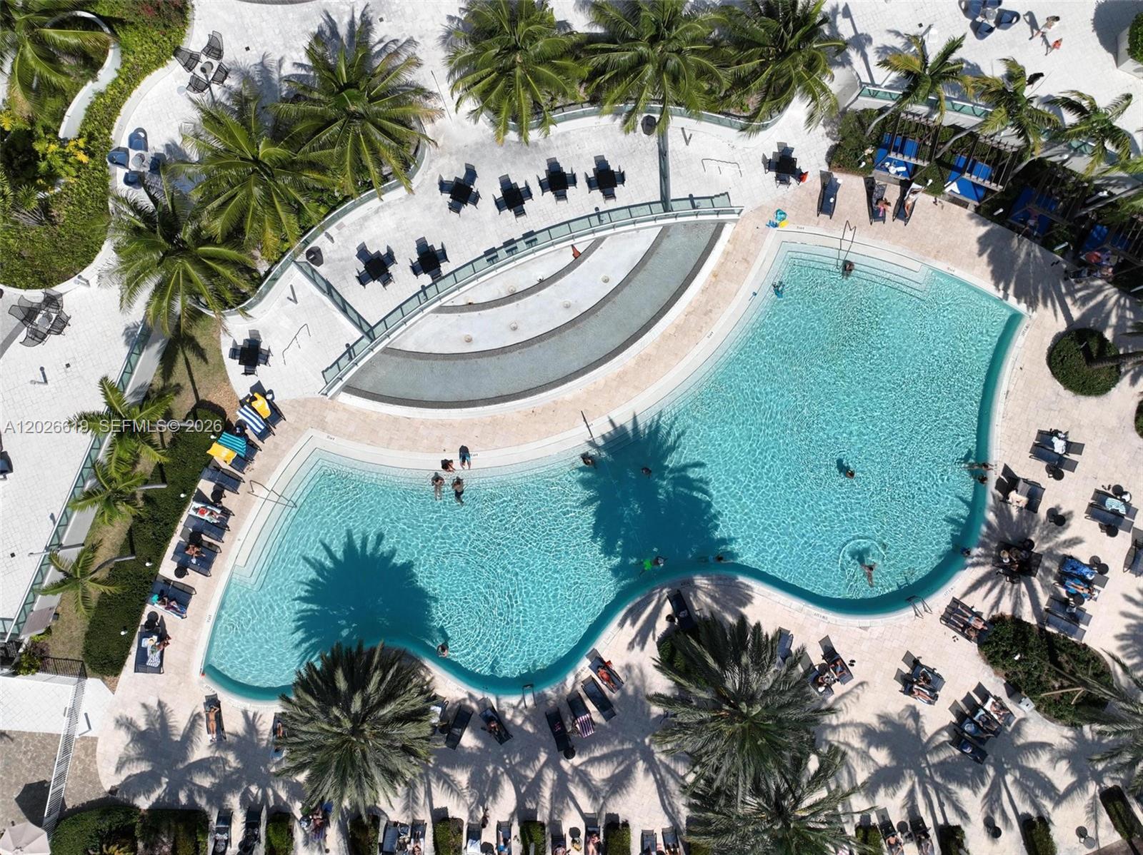 1500 Bay Road, Unit 1268S Miami Beach, FL 33139 - Photo 1 of 31 a view of a swimming pool with some plants and sitting area