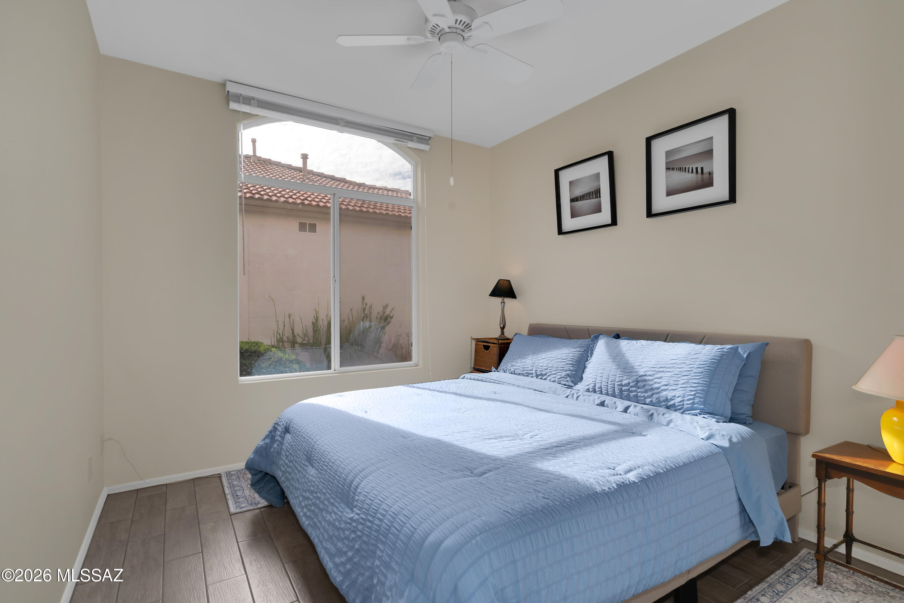64351 East Wind Ridge Circle Tucson, AZ 85739 - Photo 24 of 41 a bedroom with a bed and a window