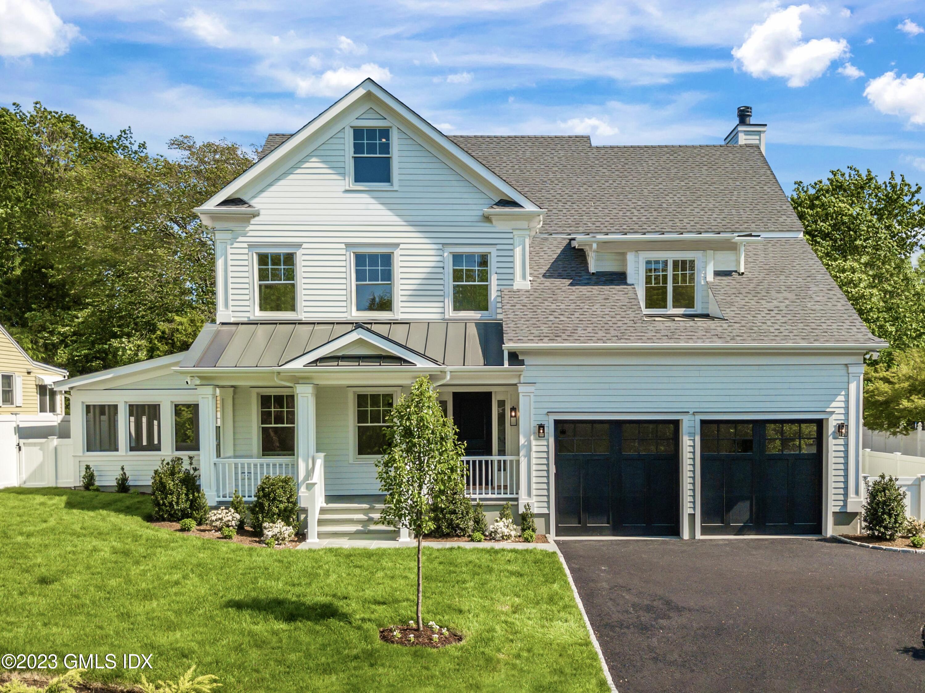 10 Sunshine Avenue Riverside, CT 06878 - Photo 1 of 27 a front view of a house with a yard