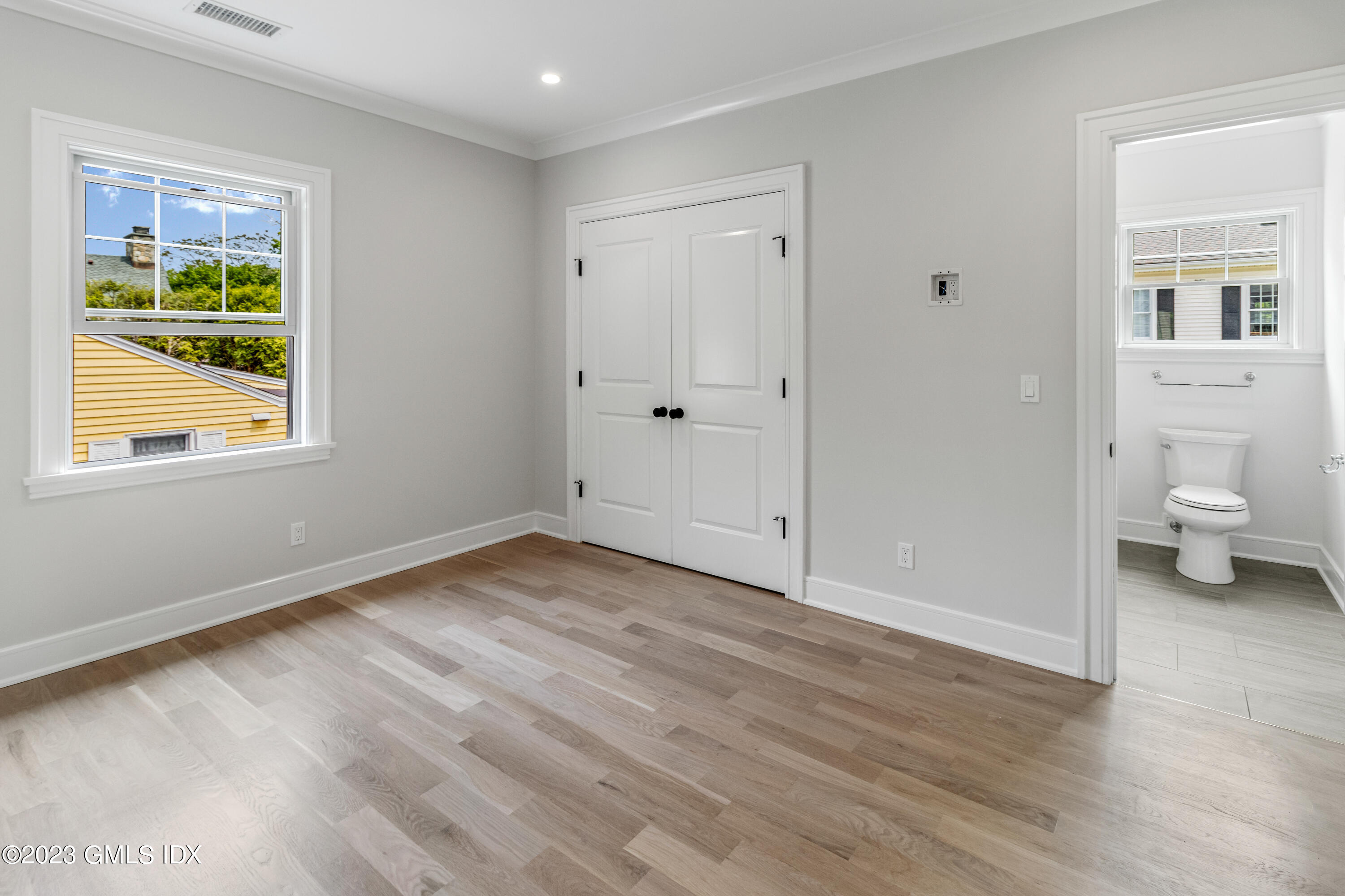 10 Sunshine Avenue Riverside, CT 06878 - Photo 13 of 27 a view of empty room with wooden floor and fan