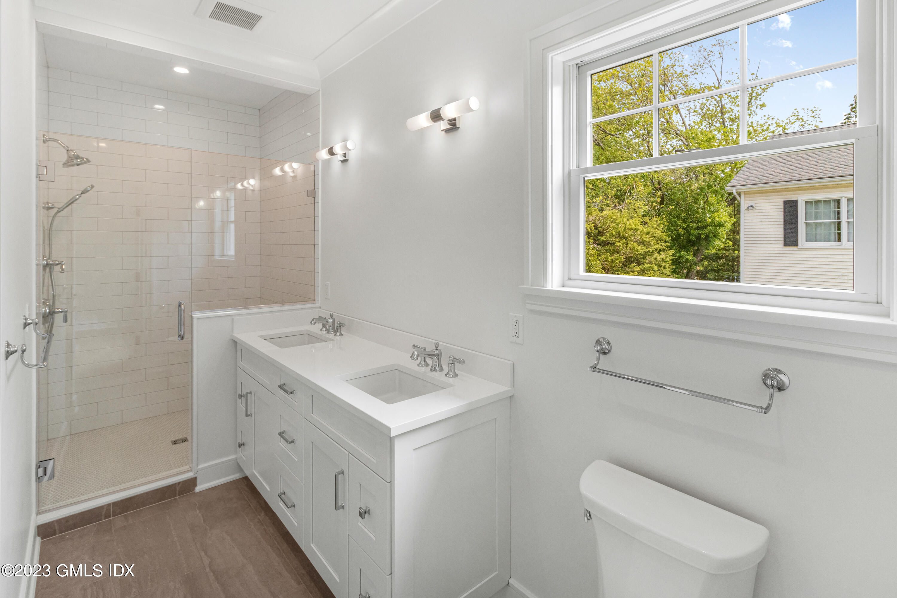 10 Sunshine Avenue Riverside, CT 06878 - Photo 14 of 27 a bathroom with a double vanity sink toilet and shower