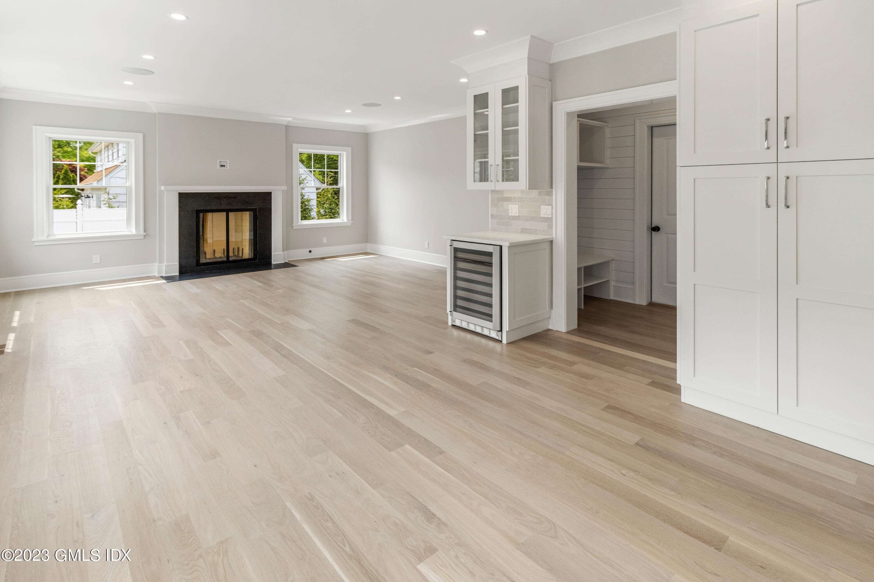 10 Sunshine Avenue Riverside, CT 06878 - Photo 6 of 27 an empty room with wooden floor and fireplace