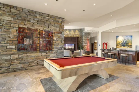 a kitchen with stainless steel appliances granite countertop a sink a stove and a microwave