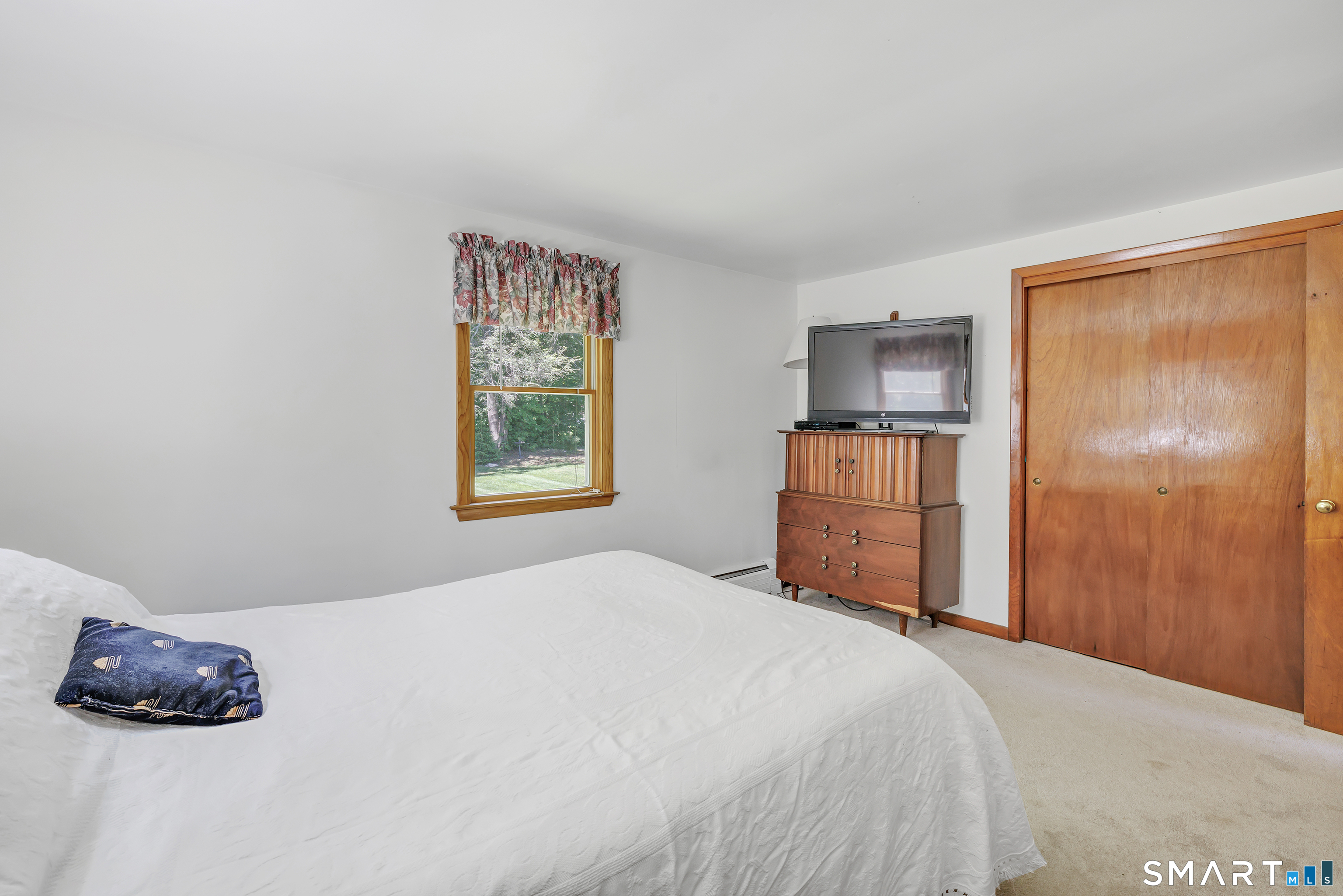 223 Wheeler Road Monroe, CT 06468 - Photo 19 of 35 a bedroom with a bed and a window
