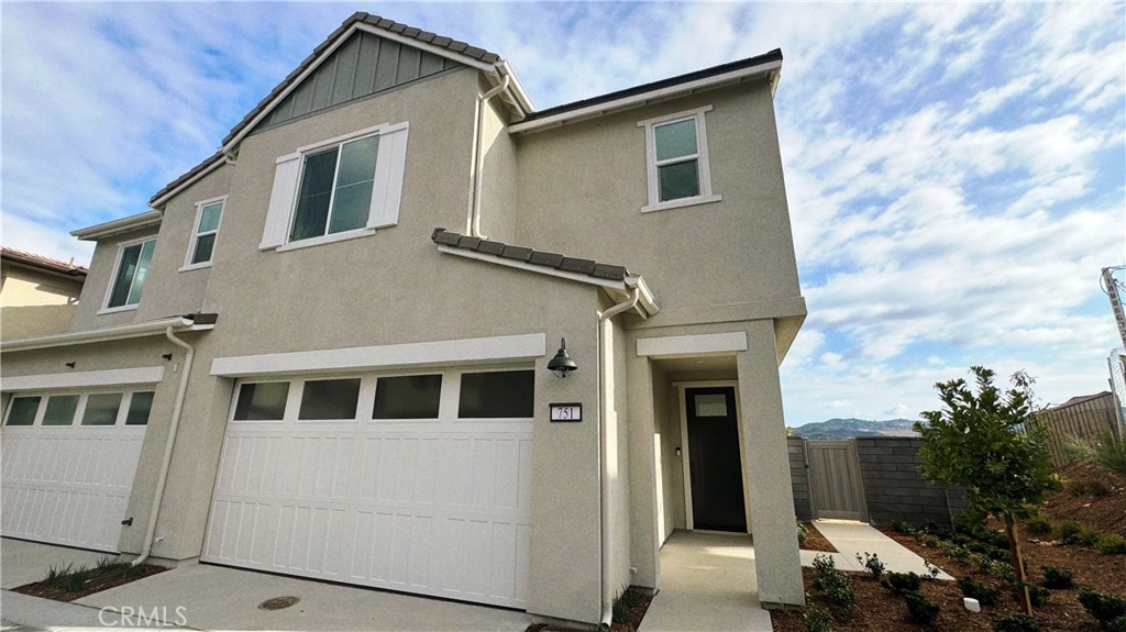 751 Cornelia Way Rancho Mission Viejo, CA 92694 - Photo 2 of 15 a front view of a house with a yard