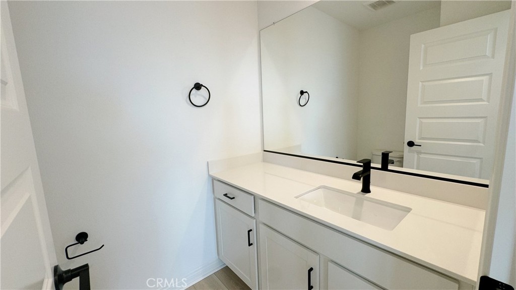 751 Cornelia Way Rancho Mission Viejo, CA 92694 - Photo 7 of 15 a bathroom with a sink and a mirror