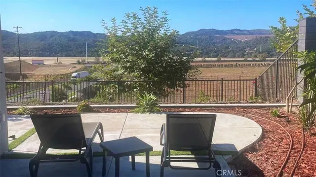 a view of a chairs and table in the terrace
