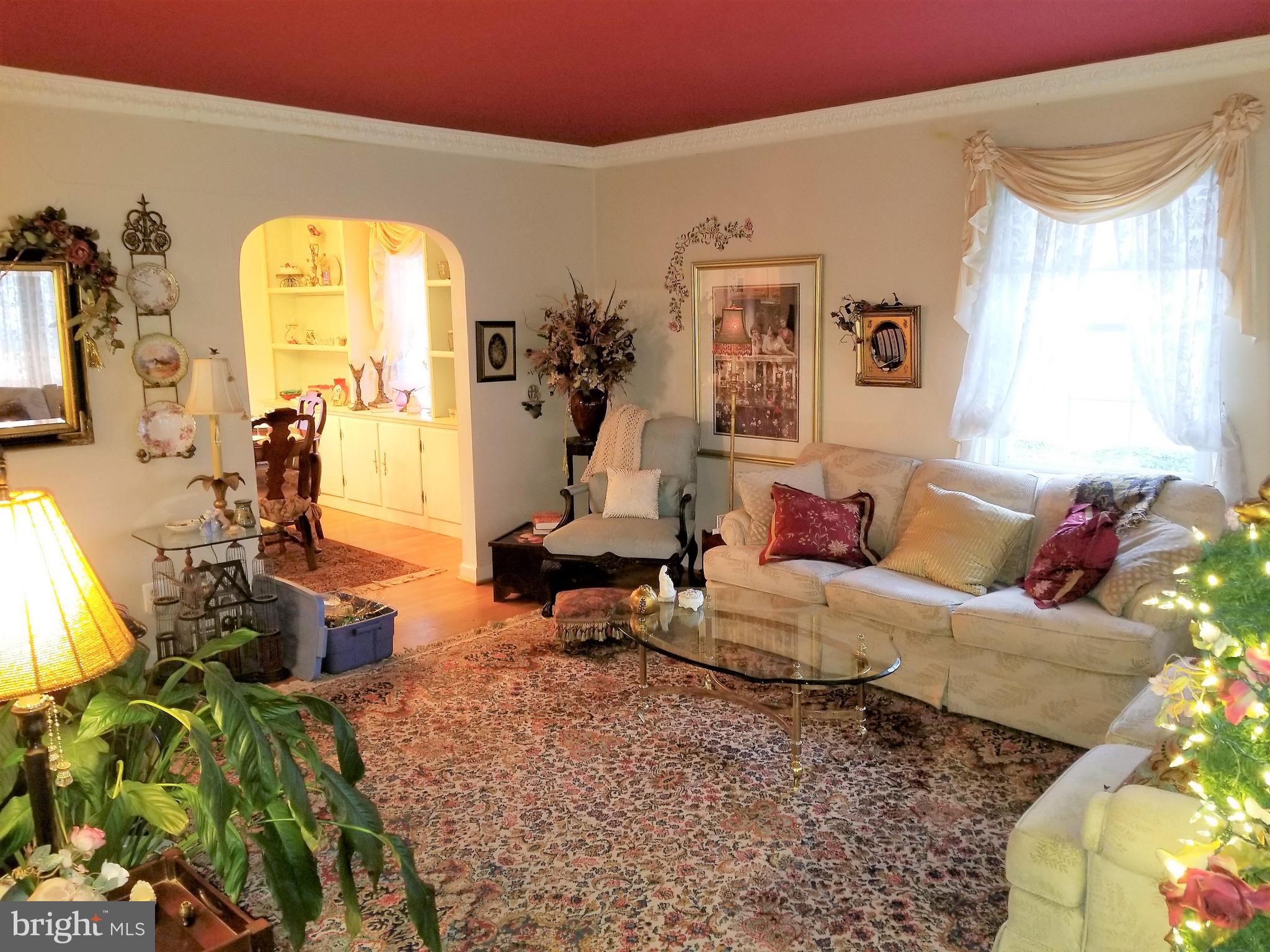 403 Oak Street Riverside, NJ 08075 - Photo 2 of 39 a living room with furniture and a large window