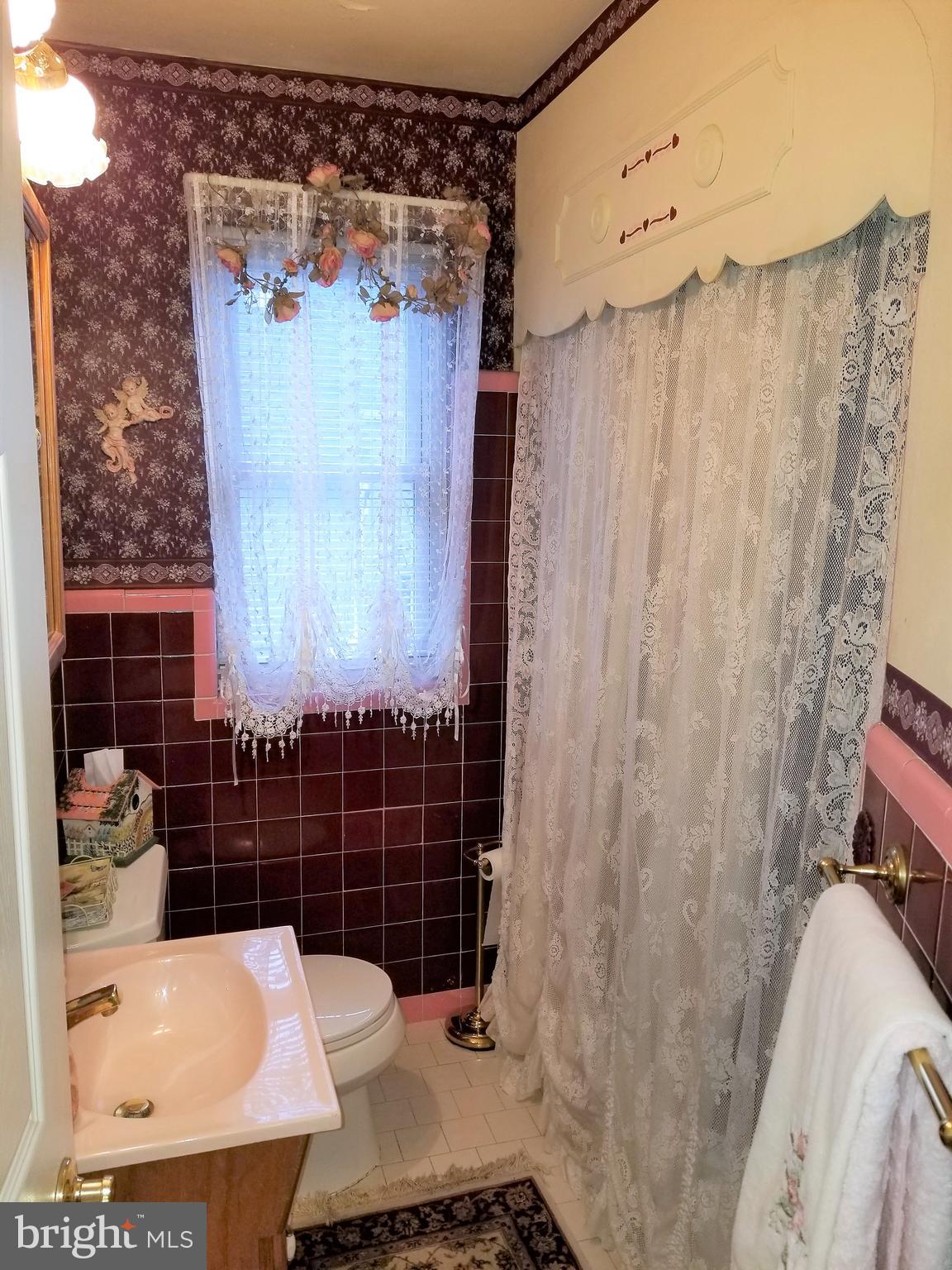 403 Oak Street Riverside, NJ 08075 - Photo 14 of 39 a bathroom with a sink toilet and shower