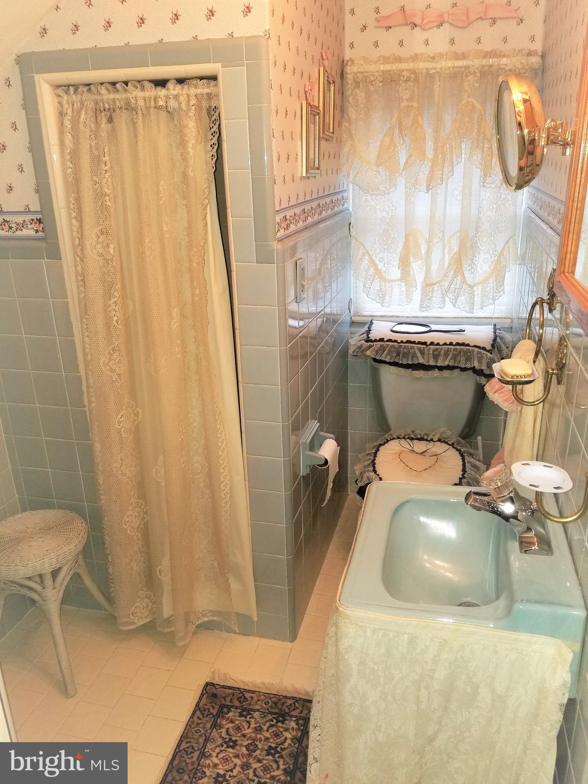 403 Oak Street Riverside, NJ 08075 - Photo 19 of 39 a bathroom with a sink and a shower curtain
