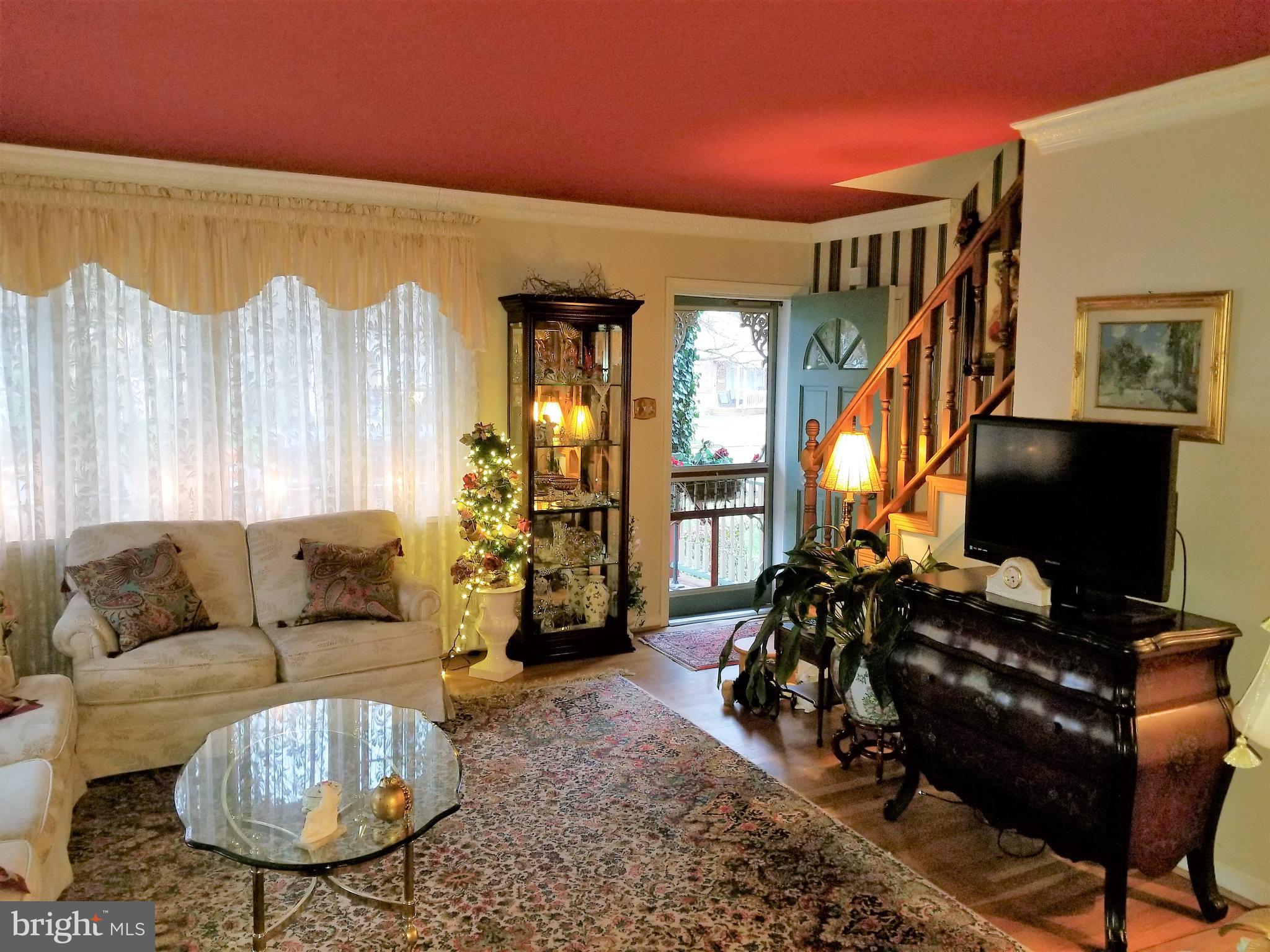 403 Oak Street Riverside, NJ 08075 - Photo 3 of 39 a living room with furniture and a large window