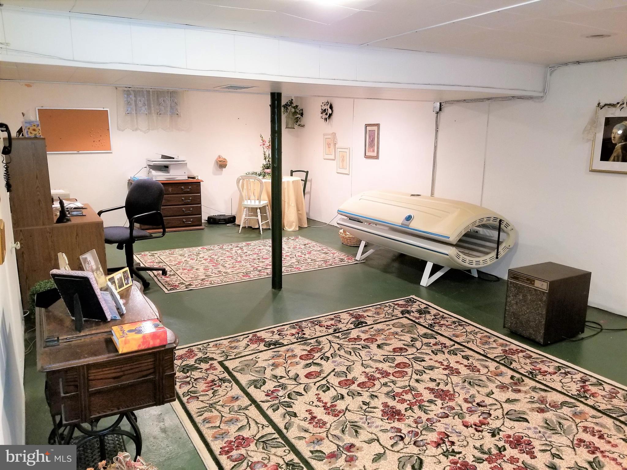 403 Oak Street Riverside, NJ 08075 - Photo 22 of 39 a living room with furniture and a rug