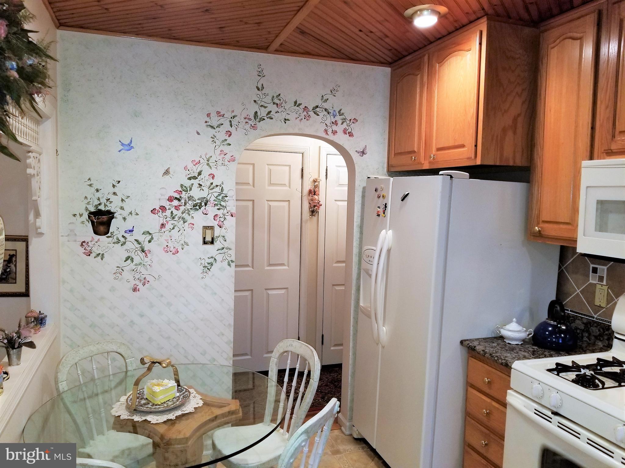 403 Oak Street Riverside, NJ 08075 - Photo 10 of 39 a kitchen with stainless steel appliances a stove a refrigerator and a window