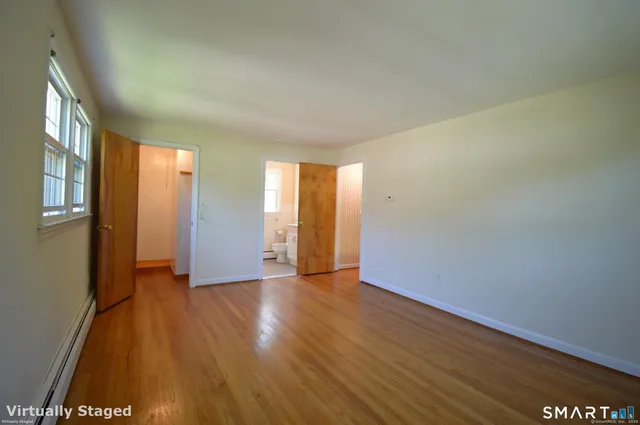 a view of an empty room with glass door