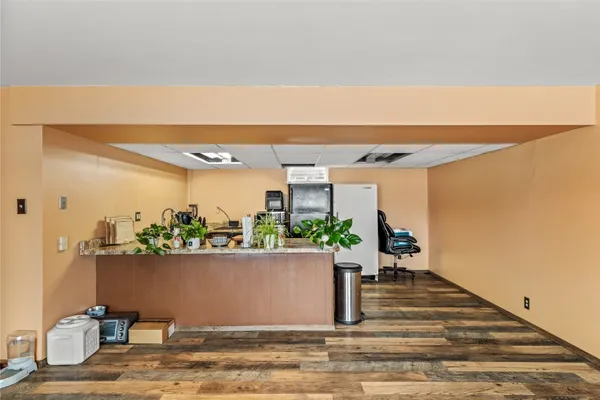a kitchen with stainless steel appliances granite countertop a sink and refrigerator