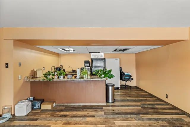 a kitchen with stainless steel appliances granite countertop a sink and refrigerator