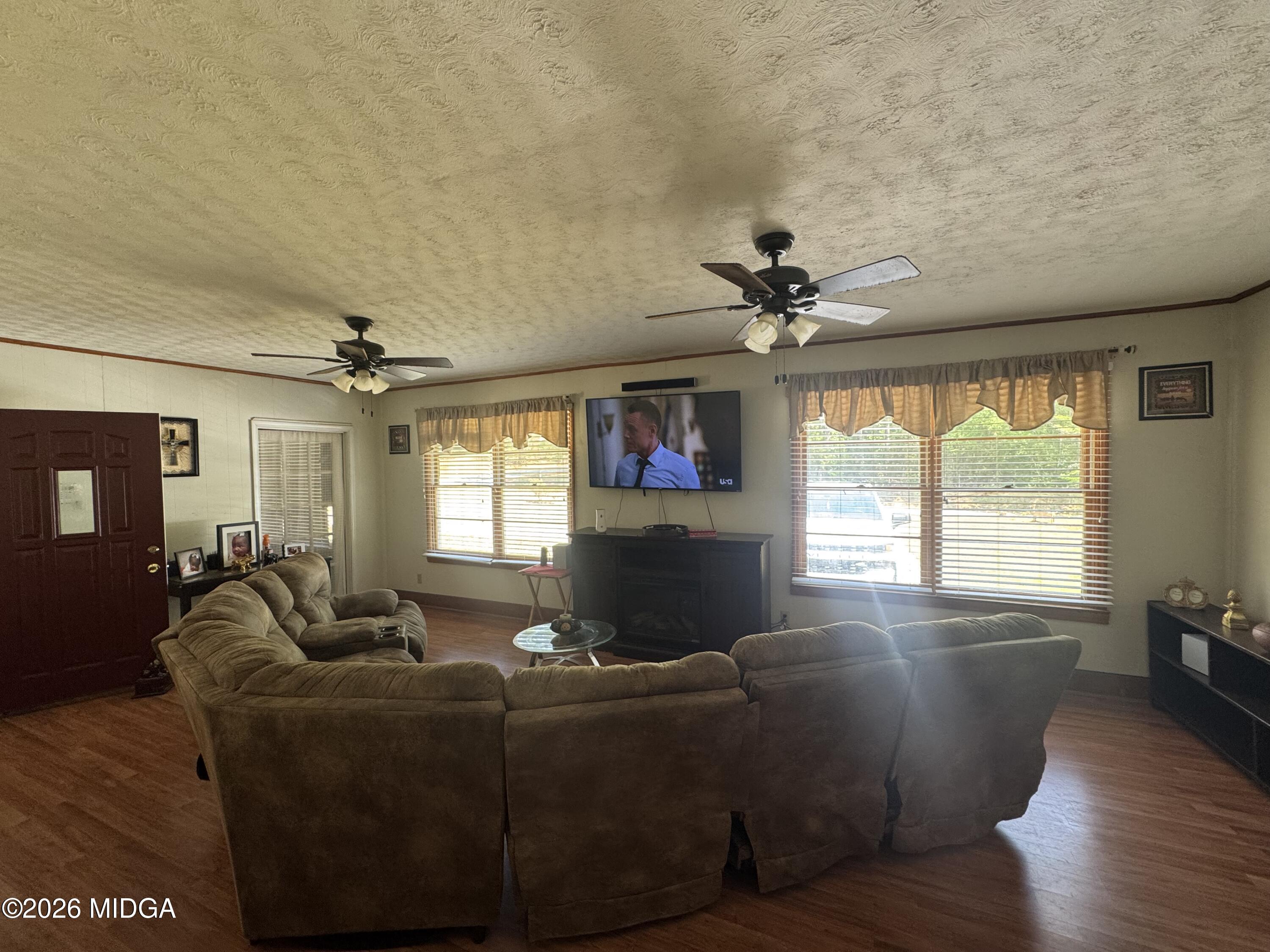 558 Old Brent Road Forsyth, GA 31029 - Photo 3 of 9 a living room with furniture and a window