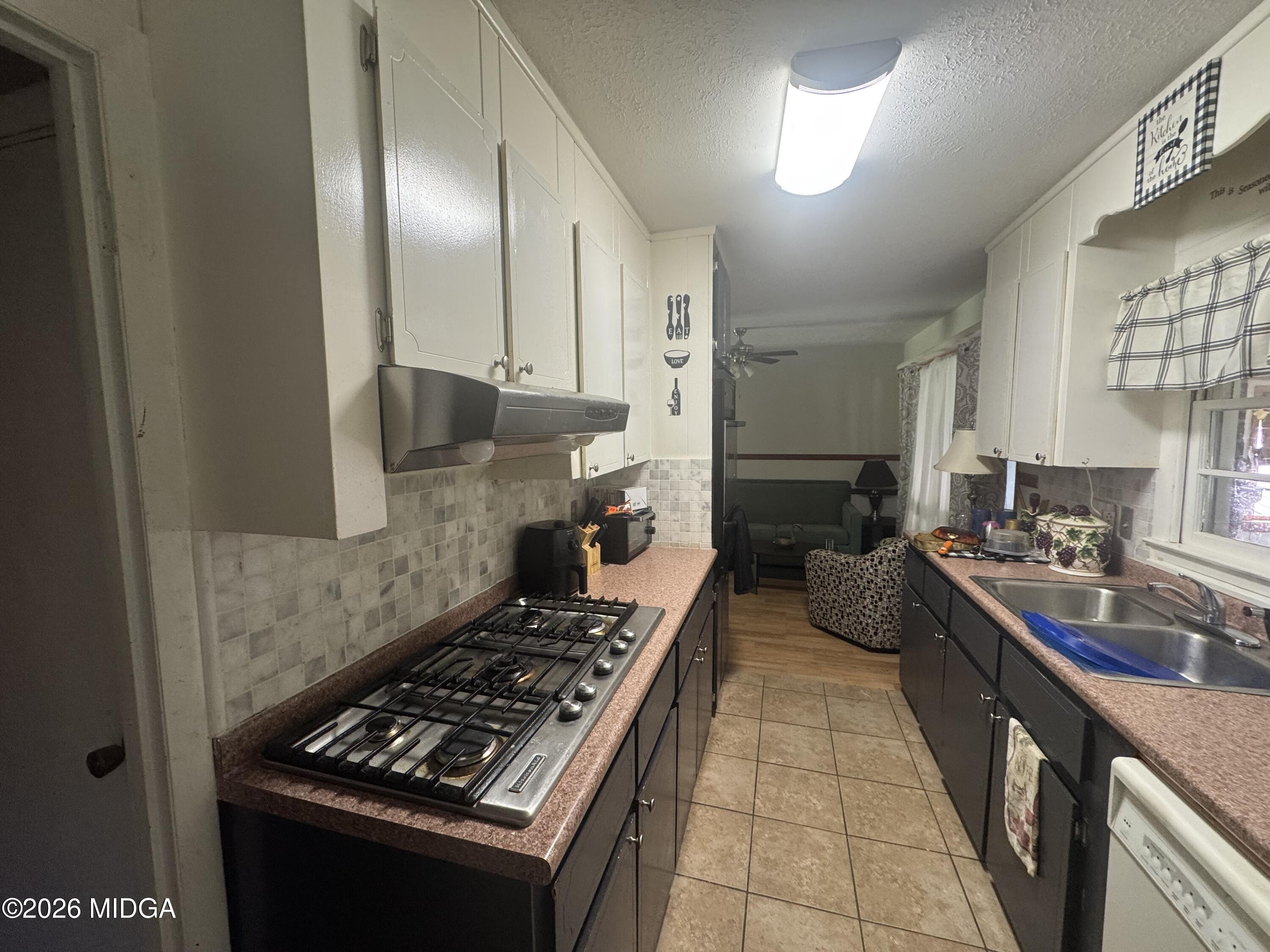 558 Old Brent Road Forsyth, GA 31029 - Photo 7 of 9 a kitchen with stove and cabinets