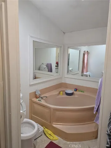 a bathroom with a toilet and a sink