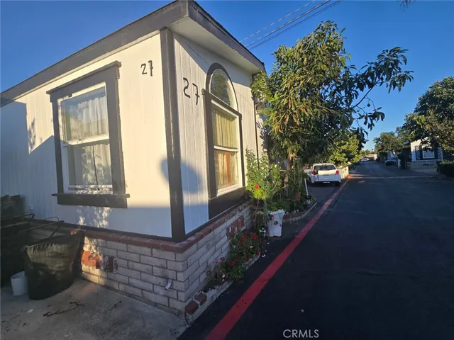 a front view of a house with outdoor space