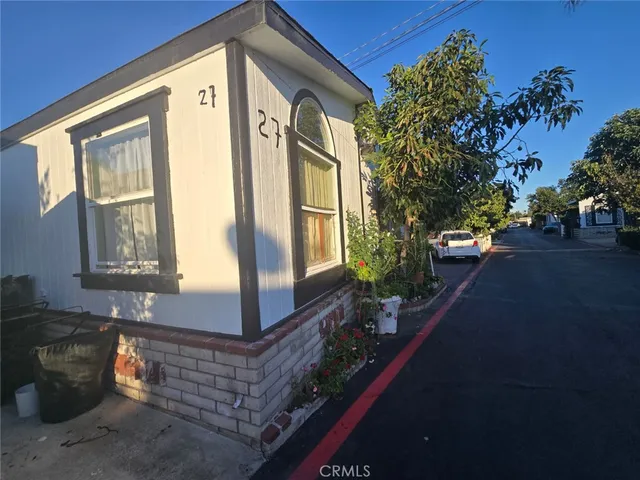 a front view of a house with outdoor space