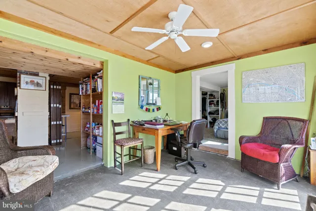 a view of a livingroom with furniture and a rug