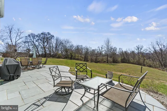 a view of a swimming pool and lounge chairs