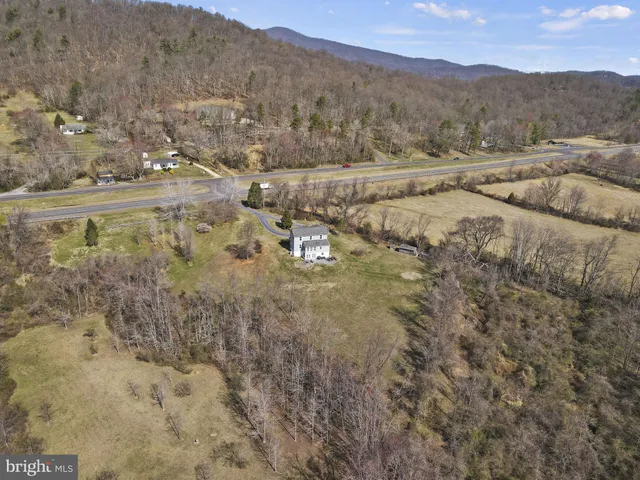 a view of a town with mountains in the background