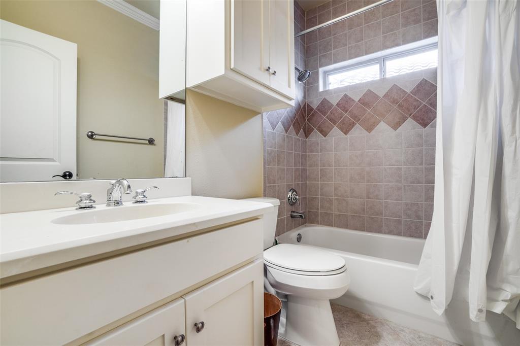 5630 Ellsworth Avenue Dallas, TX 75206 - Photo 25 of 25 a bathroom with a sink a toilet and shower