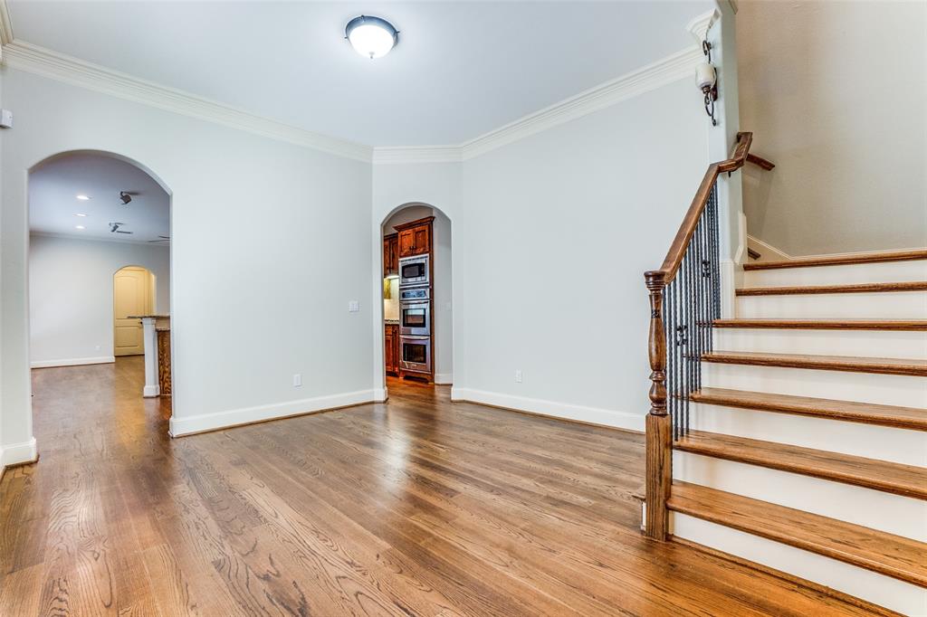 5630 Ellsworth Avenue Dallas, TX 75206 - Photo 5 of 25 a view of empty room with wooden floor and fan