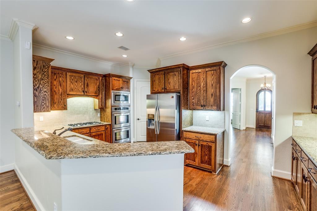 5630 Ellsworth Avenue Dallas, TX 75206 - Photo 6 of 25 a living room with stainless steel appliances kitchen island granite countertop furniture and a kitchen view