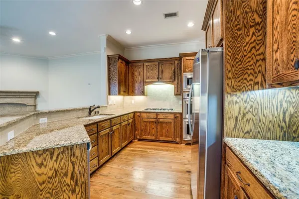 a large bathroom with a granite countertop double vanity sink and a mirror