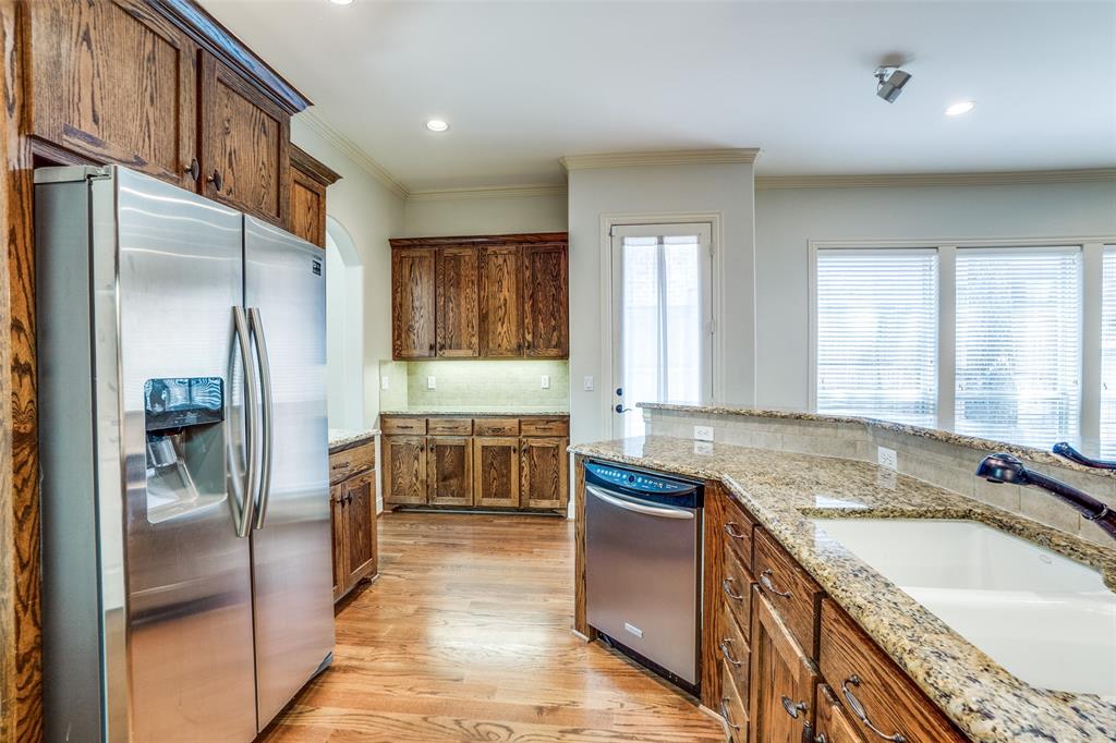 5630 Ellsworth Avenue Dallas, TX 75206 - Photo 8 of 25 a kitchen with granite countertop a sink stove and refrigerator