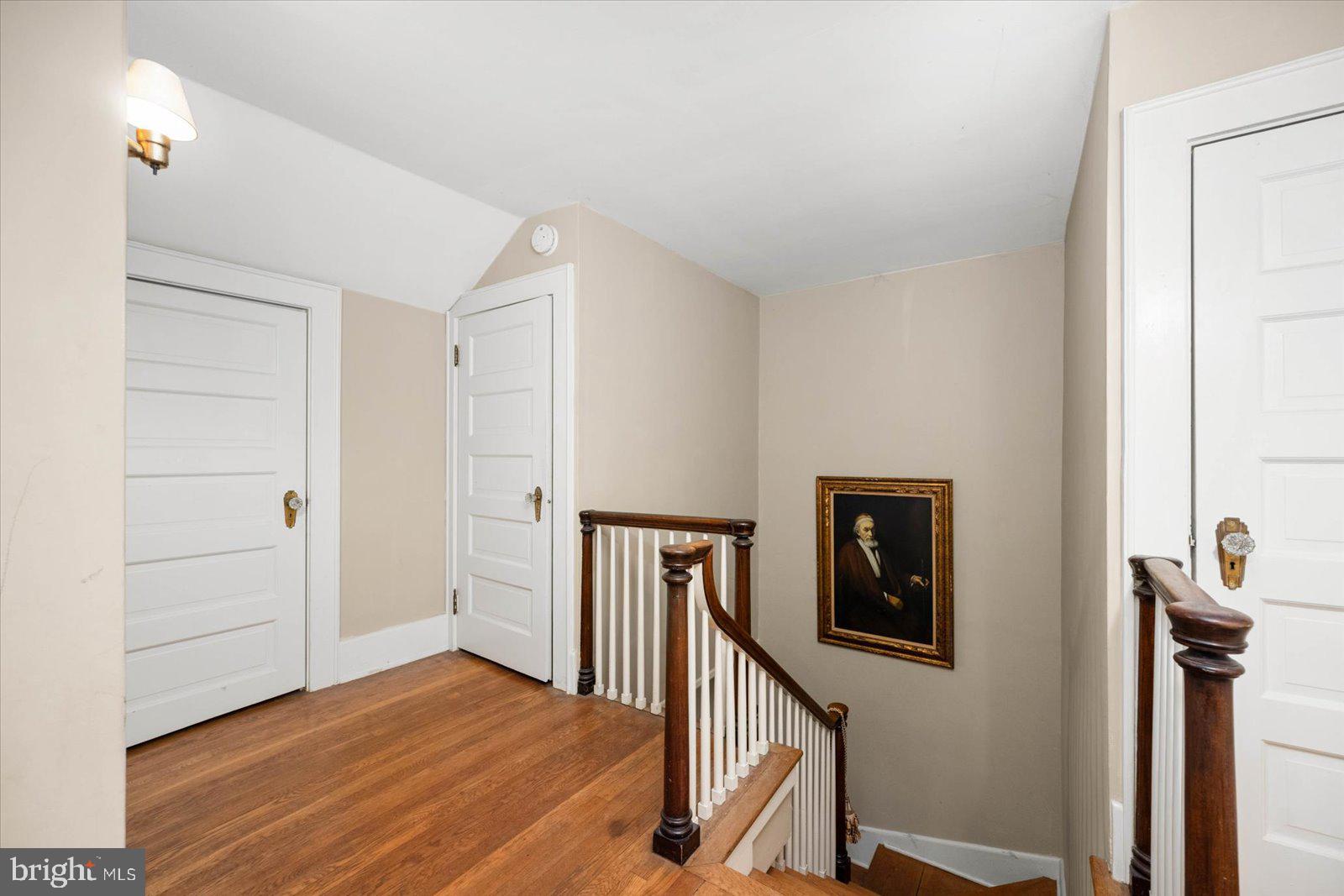 4 Washington Street Berlin, MD 21811 - Photo 24 of 125 a view of a hallway with wooden floor and staircase